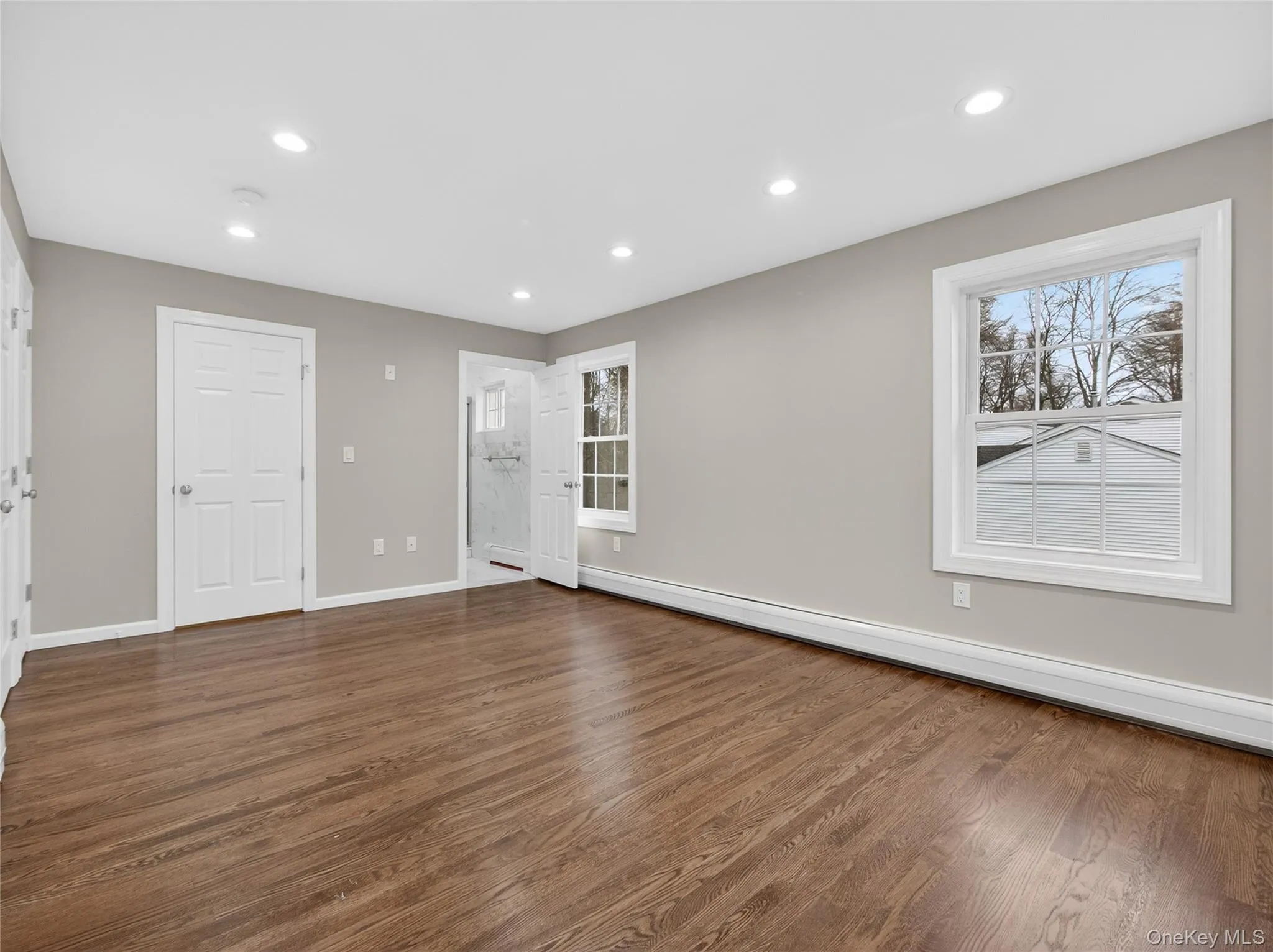 Primary Bedroom featuring Dark Hardwood Floors, Private bath and Closets Primary Bedroom featuring Dark Hardwood Floors, Private bath and Closets