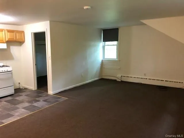 View of living room and kitchen looking towards the bedroom View of living room and kitchen looking towards the bedroom
