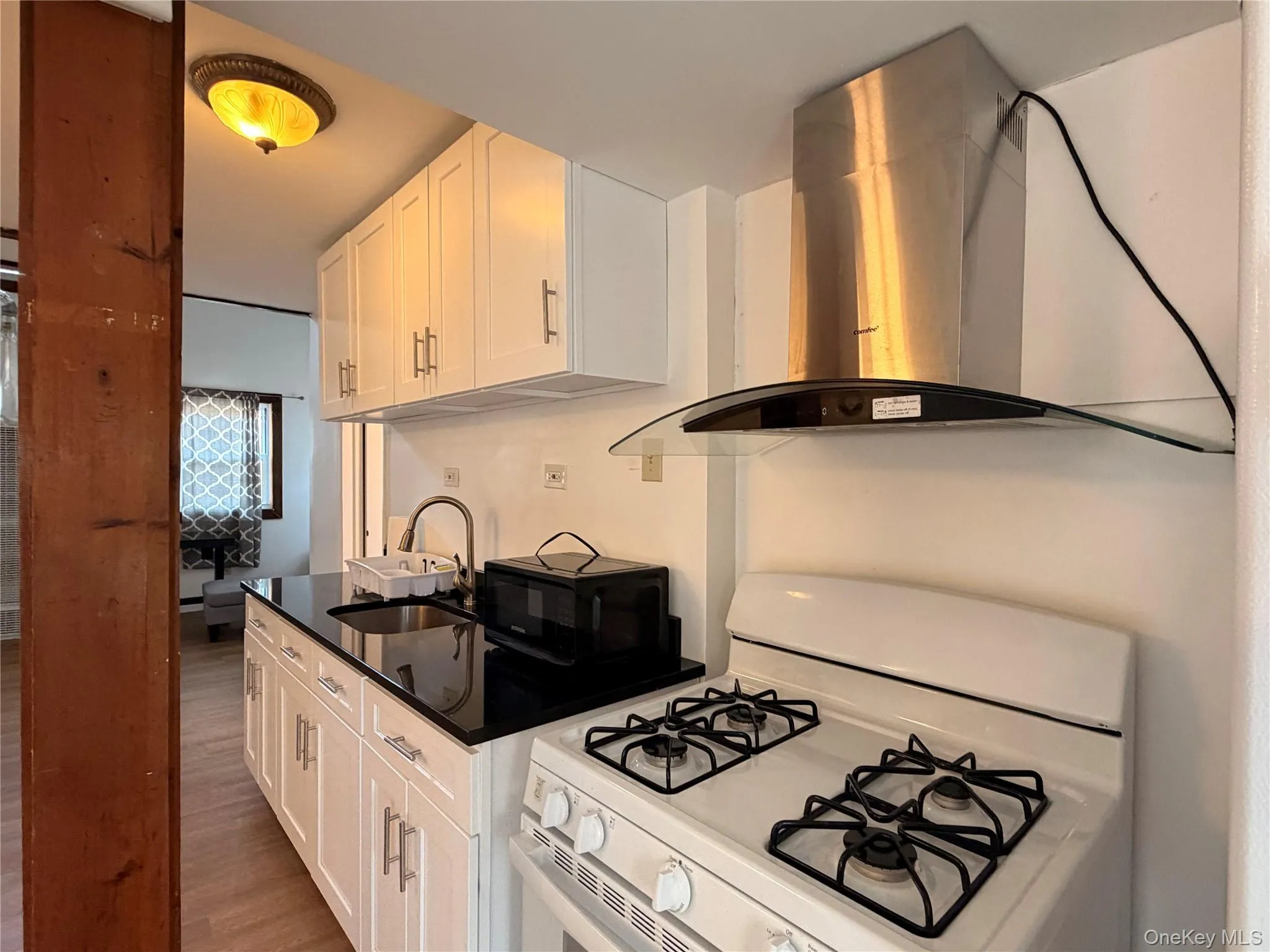 KitchenFunctional kitchen with gas range and ample cabinet space KitchenFunctional kitchen with gas range and ample cabinet space