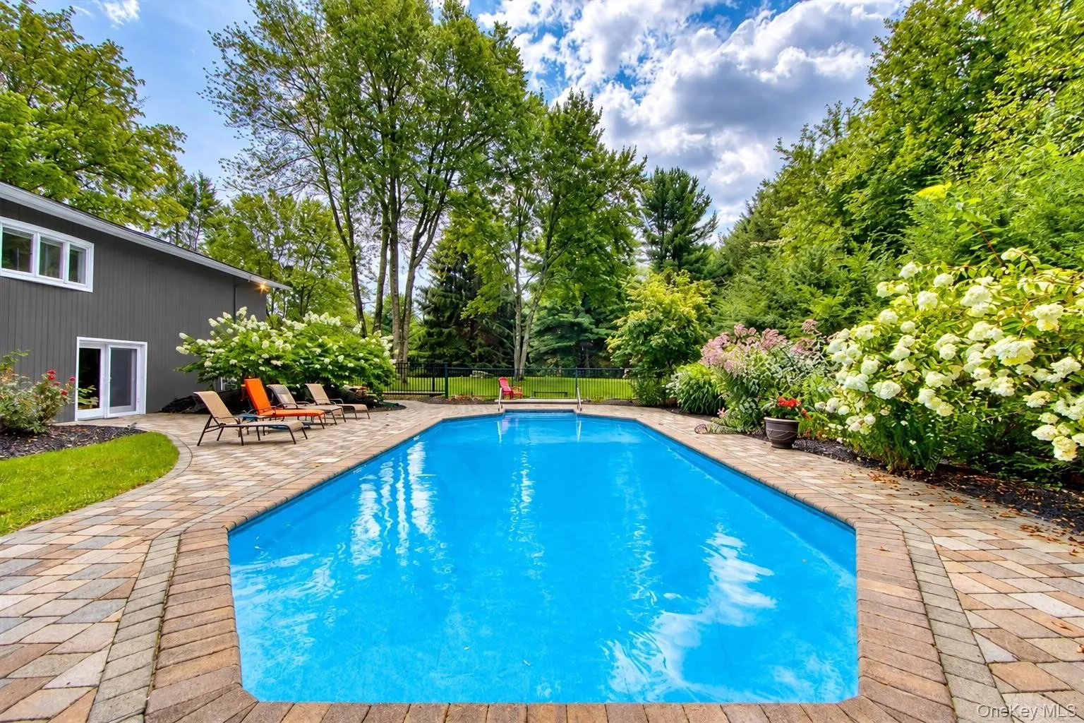 In-ground swimming pool with a paved surround In-ground swimming pool with a paved surround