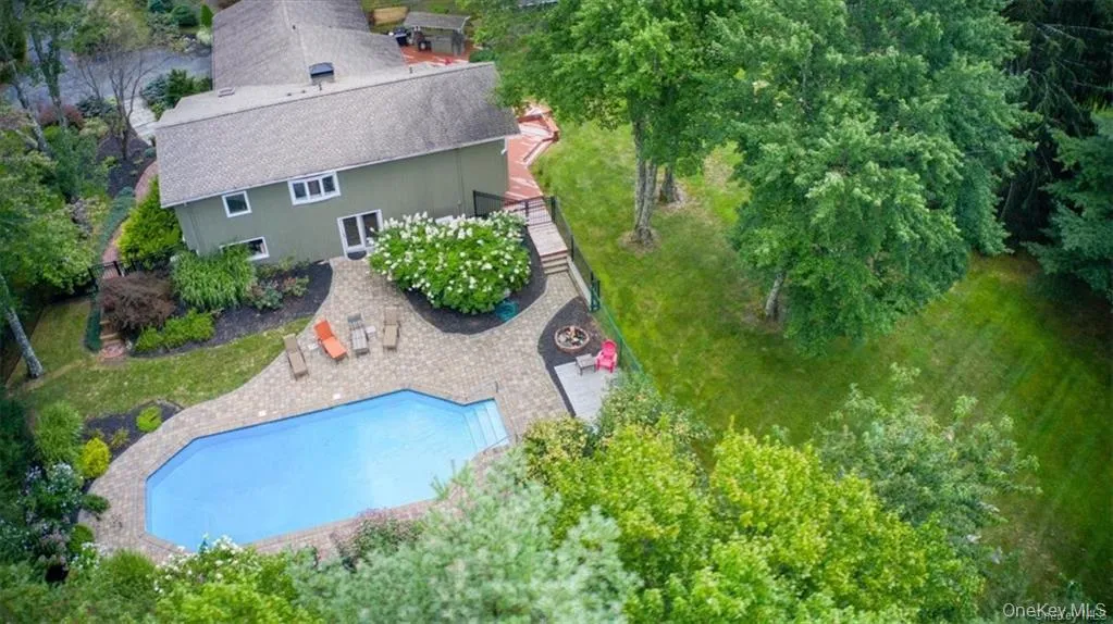 View from above of property featuring a pool area View from above of property featuring a pool area