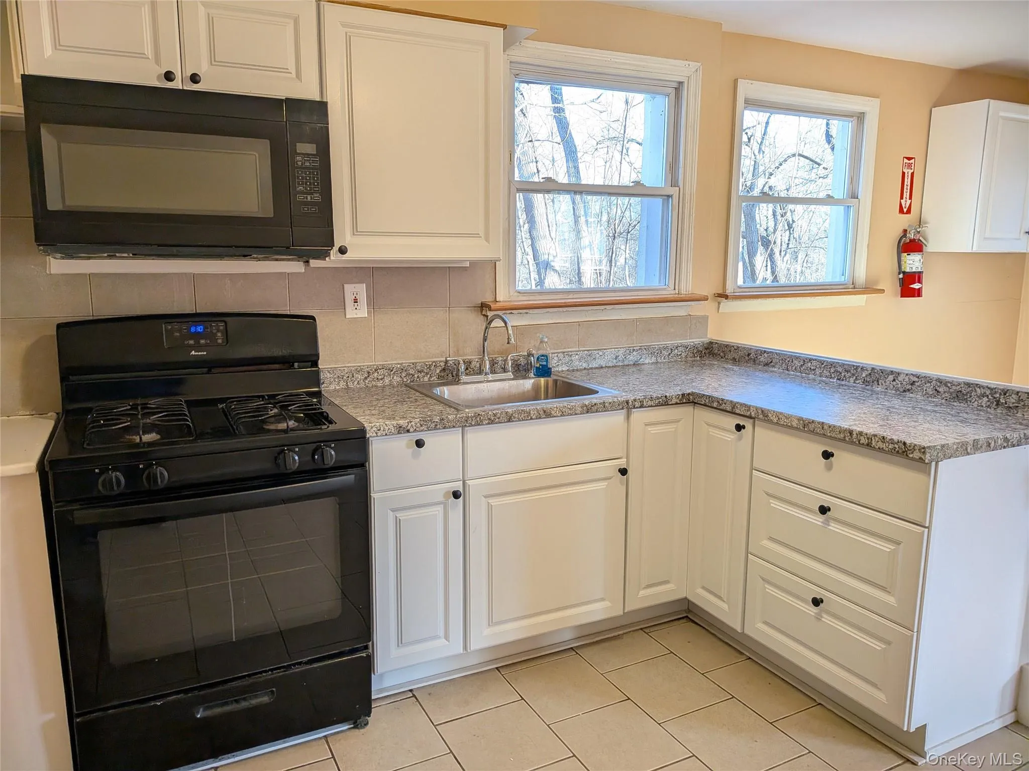 Updated kitchenn with new cabinets, counter and sink Updated kitchenn with new cabinets, counter and sink