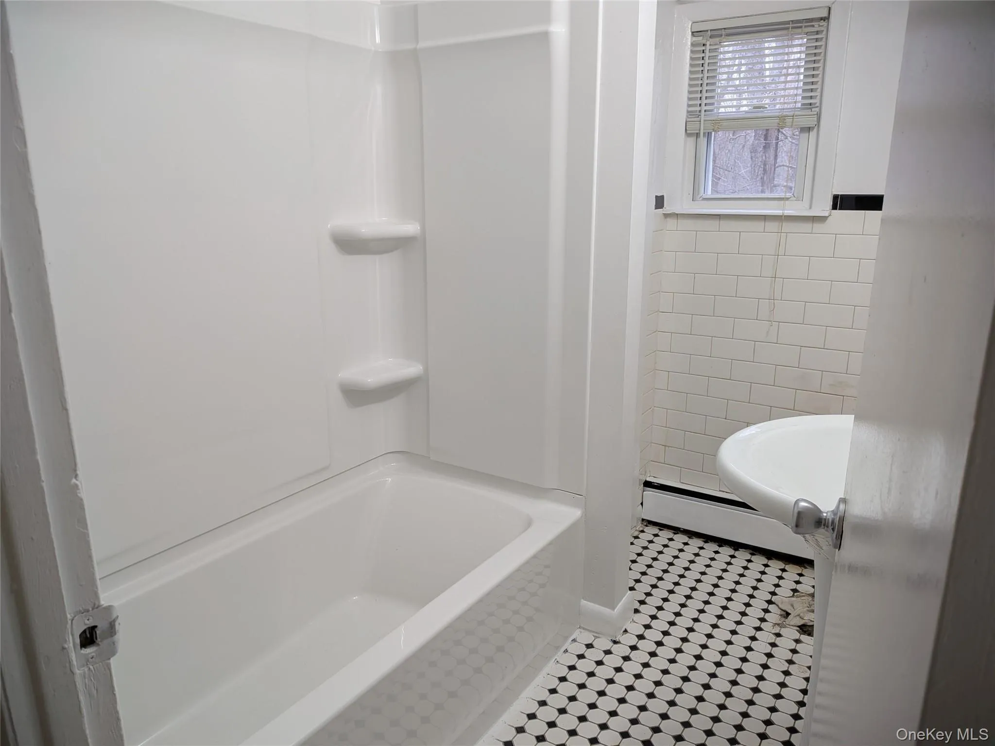 Updated bath with new tub/shower and toilet Updated bath with new tub/shower and toilet