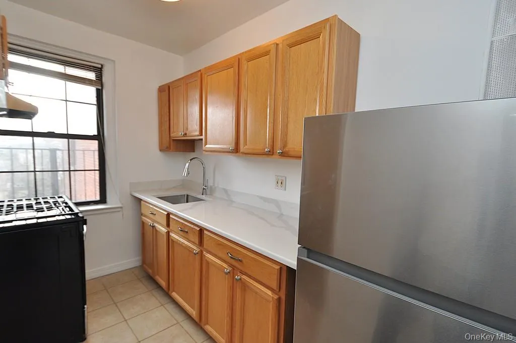 Kitchen has Quarts counters and stainless steel appliances Kitchen has Quarts counters and stainless steel appliances