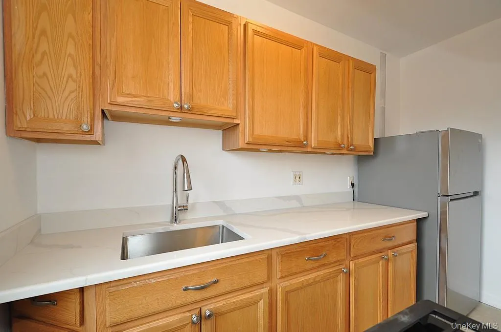 Kitchen has Quarts counters and stainless steel appliances Kitchen has Quarts counters and stainless steel appliances