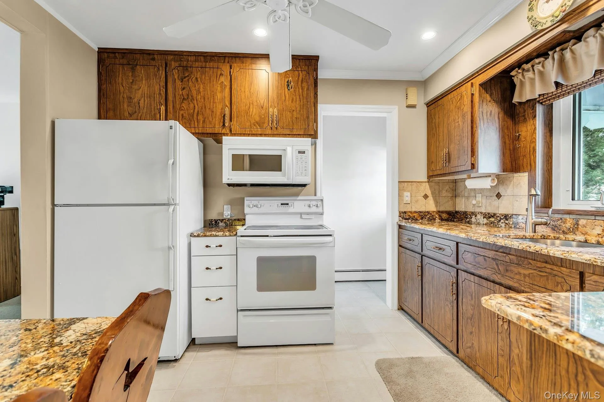 White appliance in the kitchen offers stove, Refrigerator, microwave and dishwasher White appliance in the kitchen offers stove, Refrigerator, microwave and dishwasher