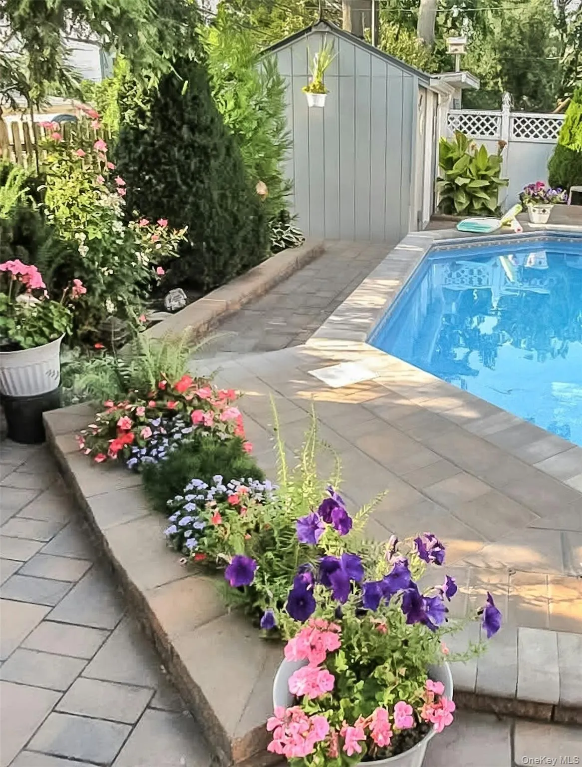 View of pool featuring a storage unit View of pool featuring a storage unit