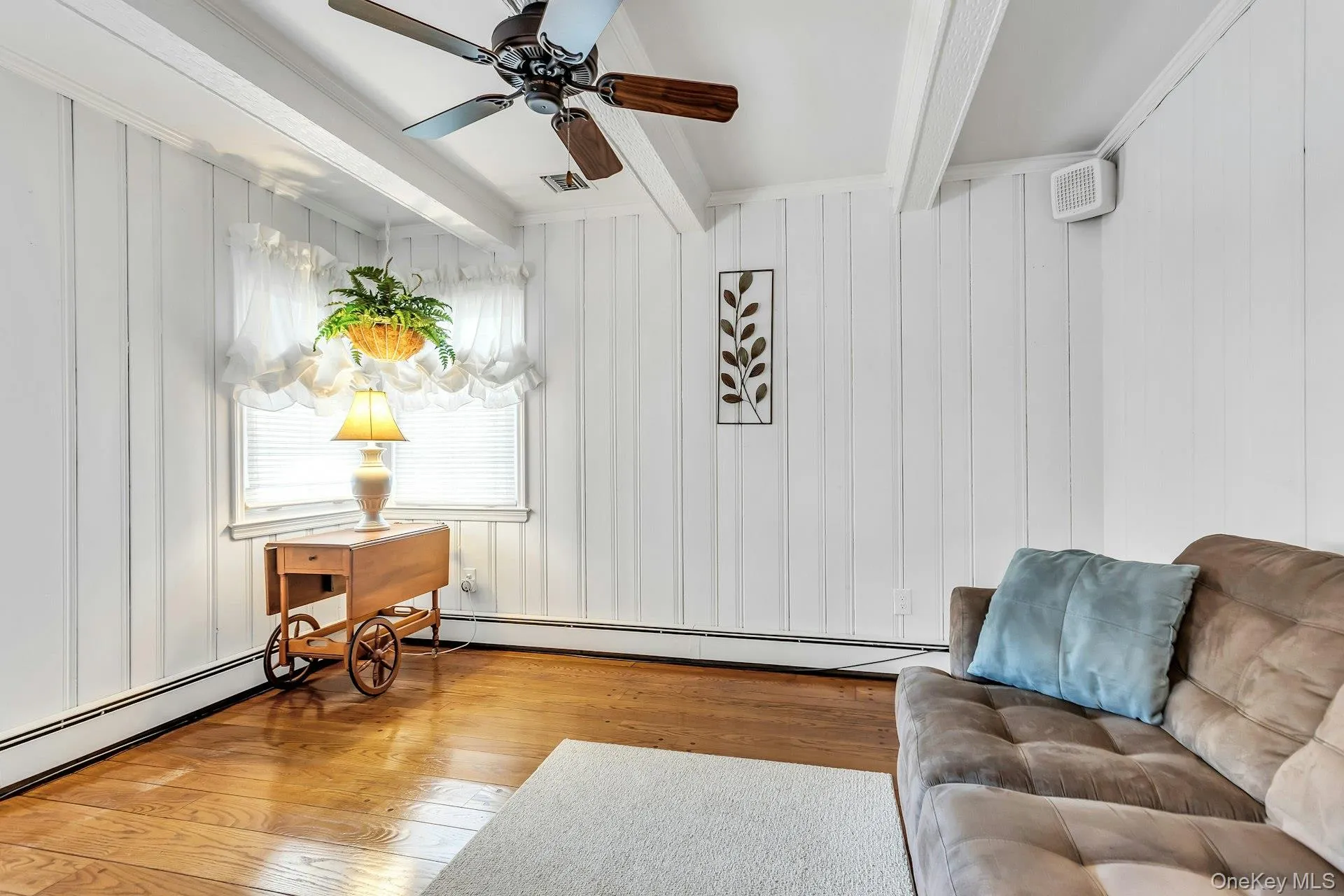 Den with Beamed Ceiling and Hardwood Floors Den with Beamed Ceiling and Hardwood Floors