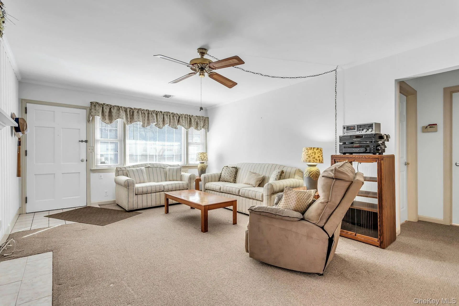 Large window in LR with tons of natural light and HW Floors under carpeting Large window in LR with tons of natural light and HW Floors under carpeting