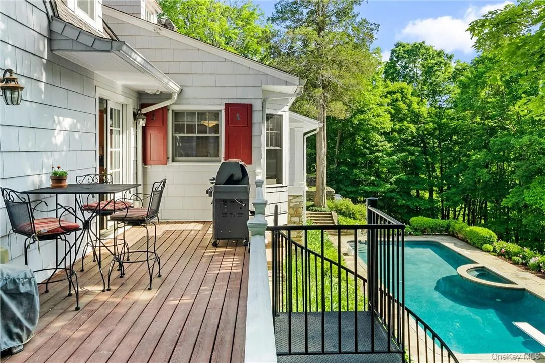 Deck w/ BBQ and stairs to pool Deck w/ BBQ and stairs to pool