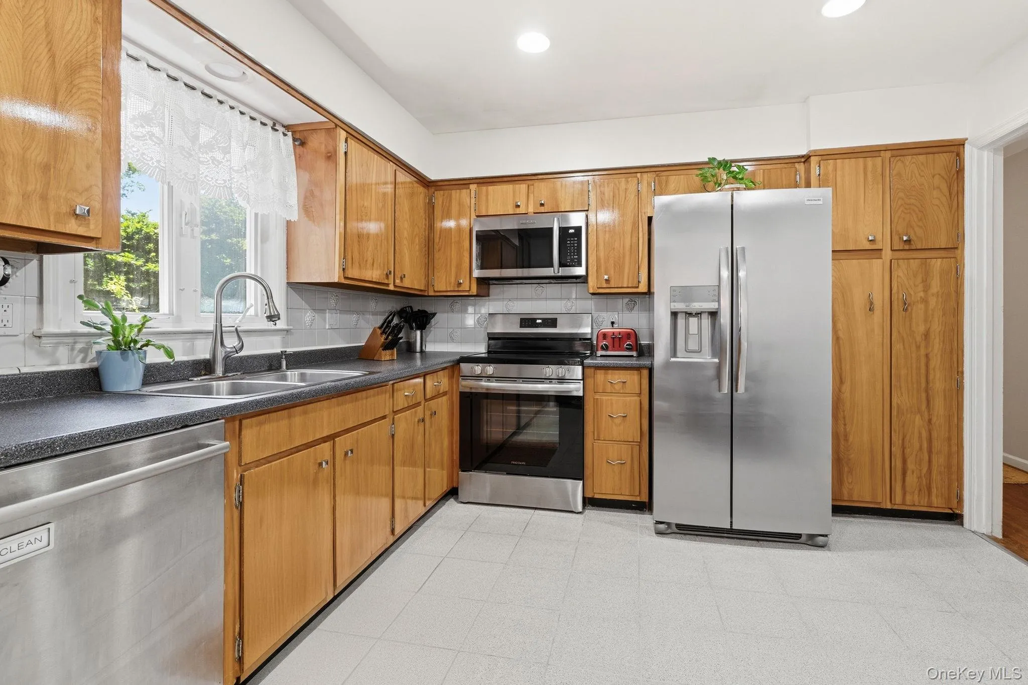 Charm meets everyday functionality in this spacious eat-in kitchen. Charm meets everyday functionality in this spacious eat-in kitchen.
