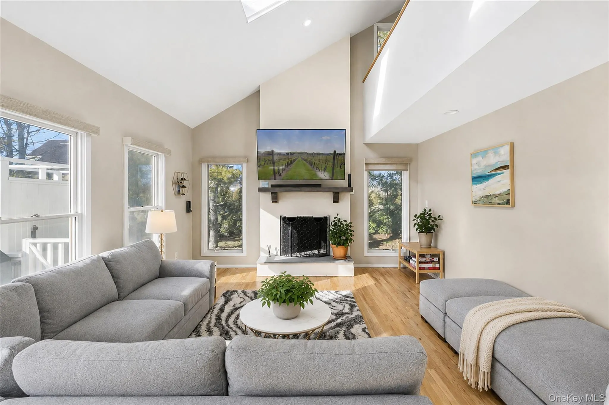 Contemporary post-modern design offering an open living area with fireplace. Contemporary post-modern design offering an open living area with fireplace.