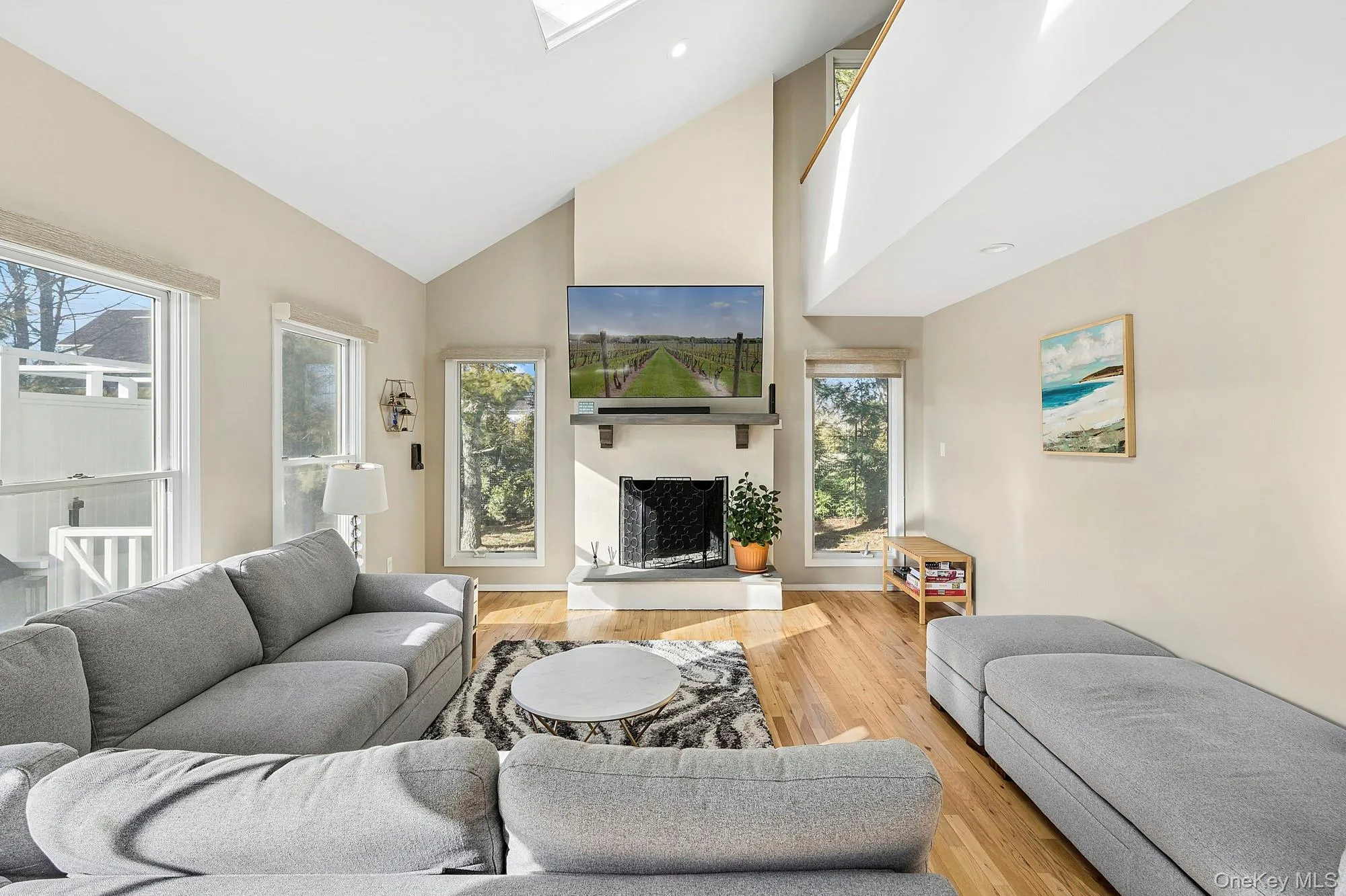 Contemporary post-modern design offering an open living area with fireplace Contemporary post-modern design offering an open living area with fireplace