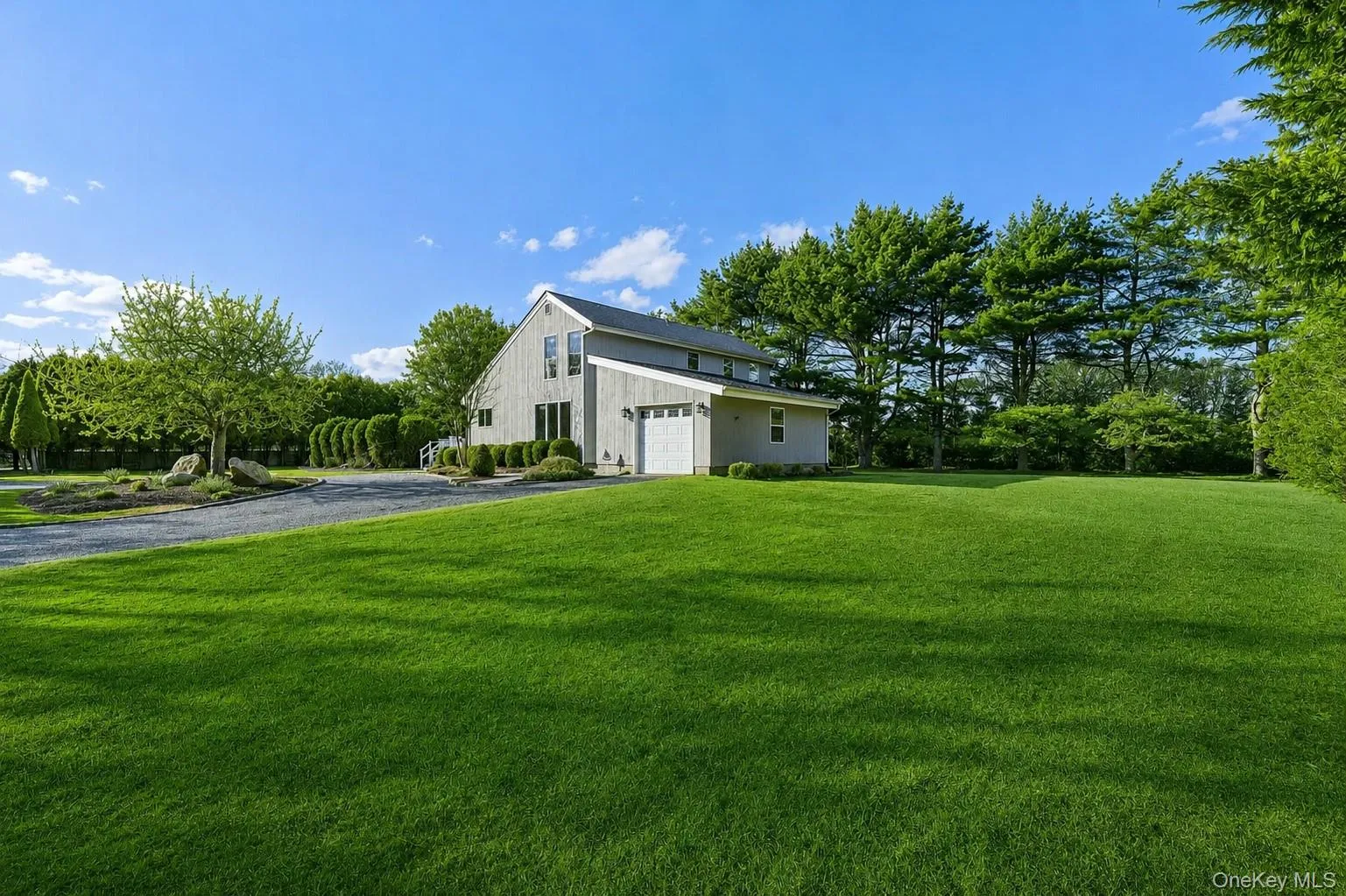 Flagship property south of the highway featuring a long private driveway and a classic front-facing façade. Flagship property south of the highway featuring a long private driveway and a classic front-facing façade.
