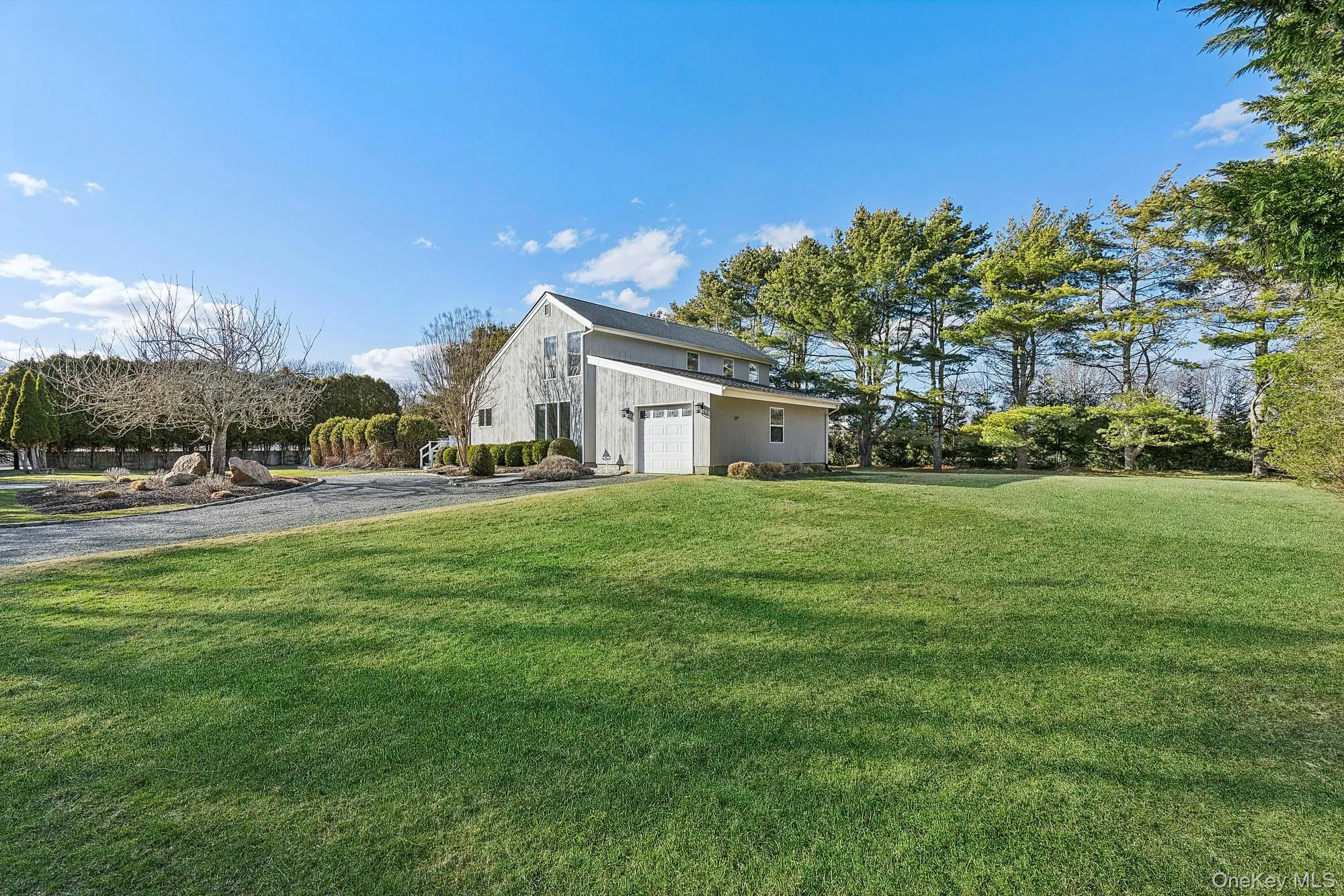 Flagship property south of the highway featuring a long private driveway and a classic front-facing façade. Flagship property south of the highway featuring a long private driveway and a classic front-facing façade.