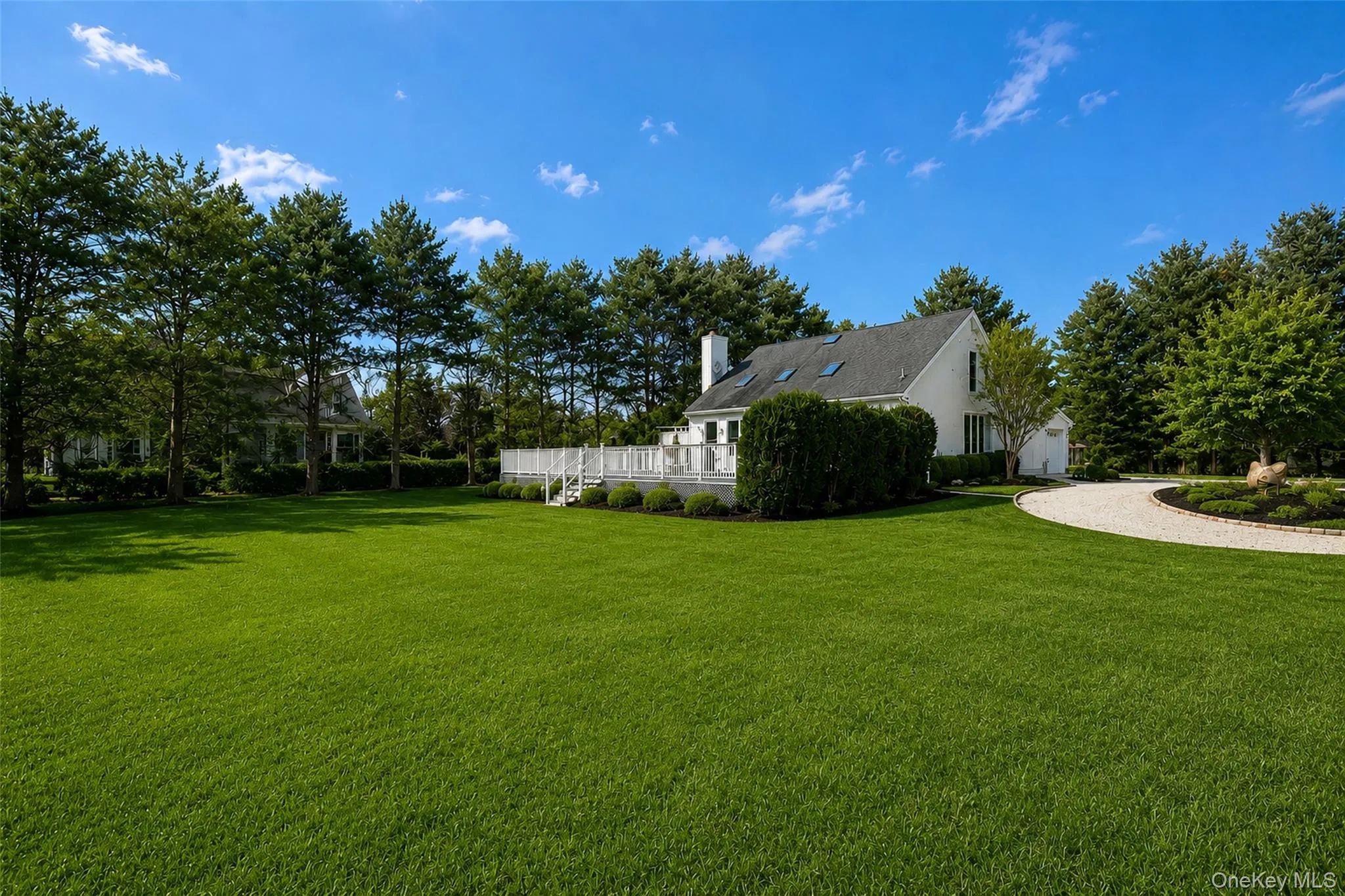 Side yard offers generous lawn space and an inground pool. Side yard offers generous lawn space and an inground pool.