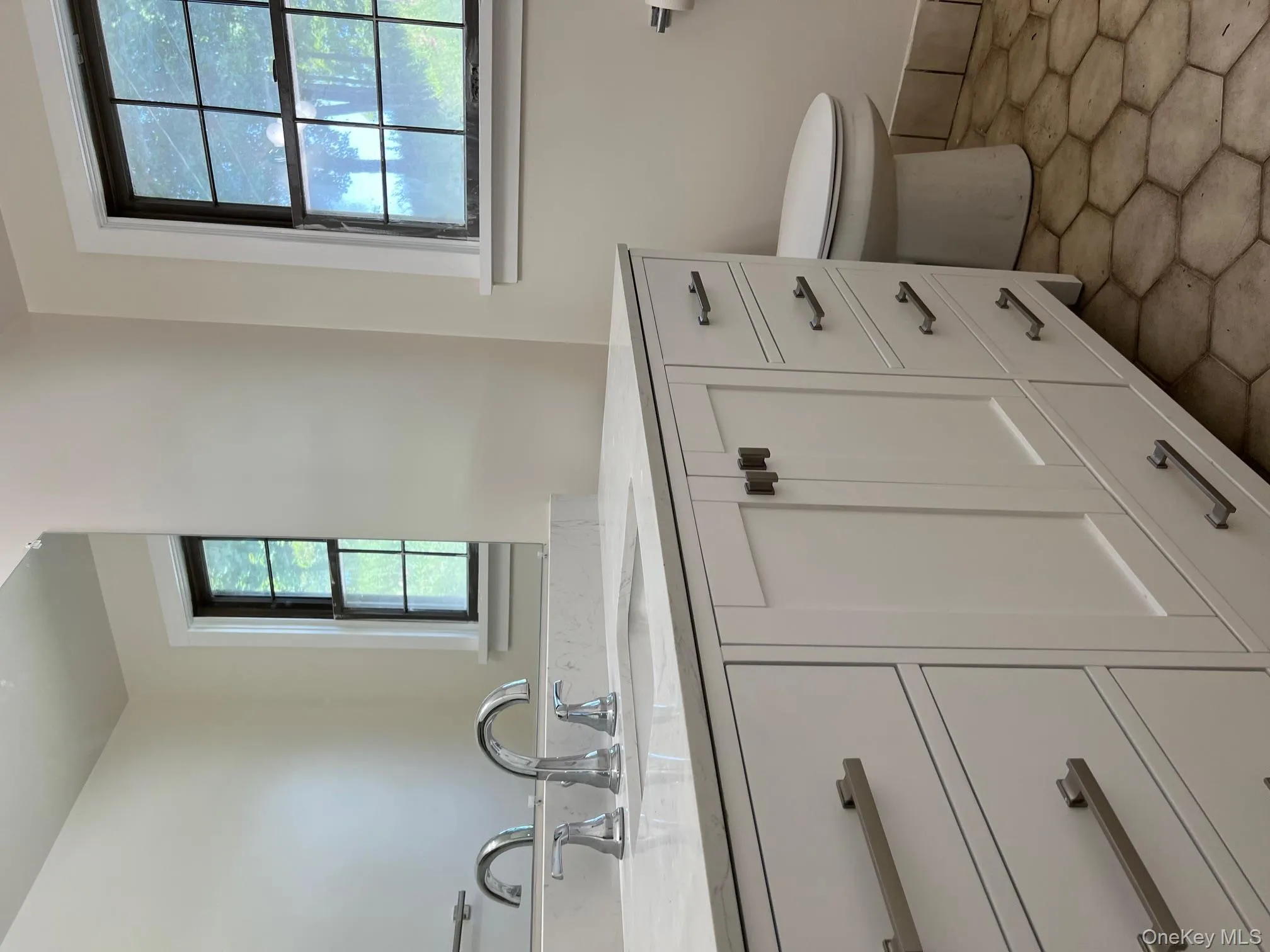 Bathroom featuring vanity and toilet Bathroom featuring vanity and toilet