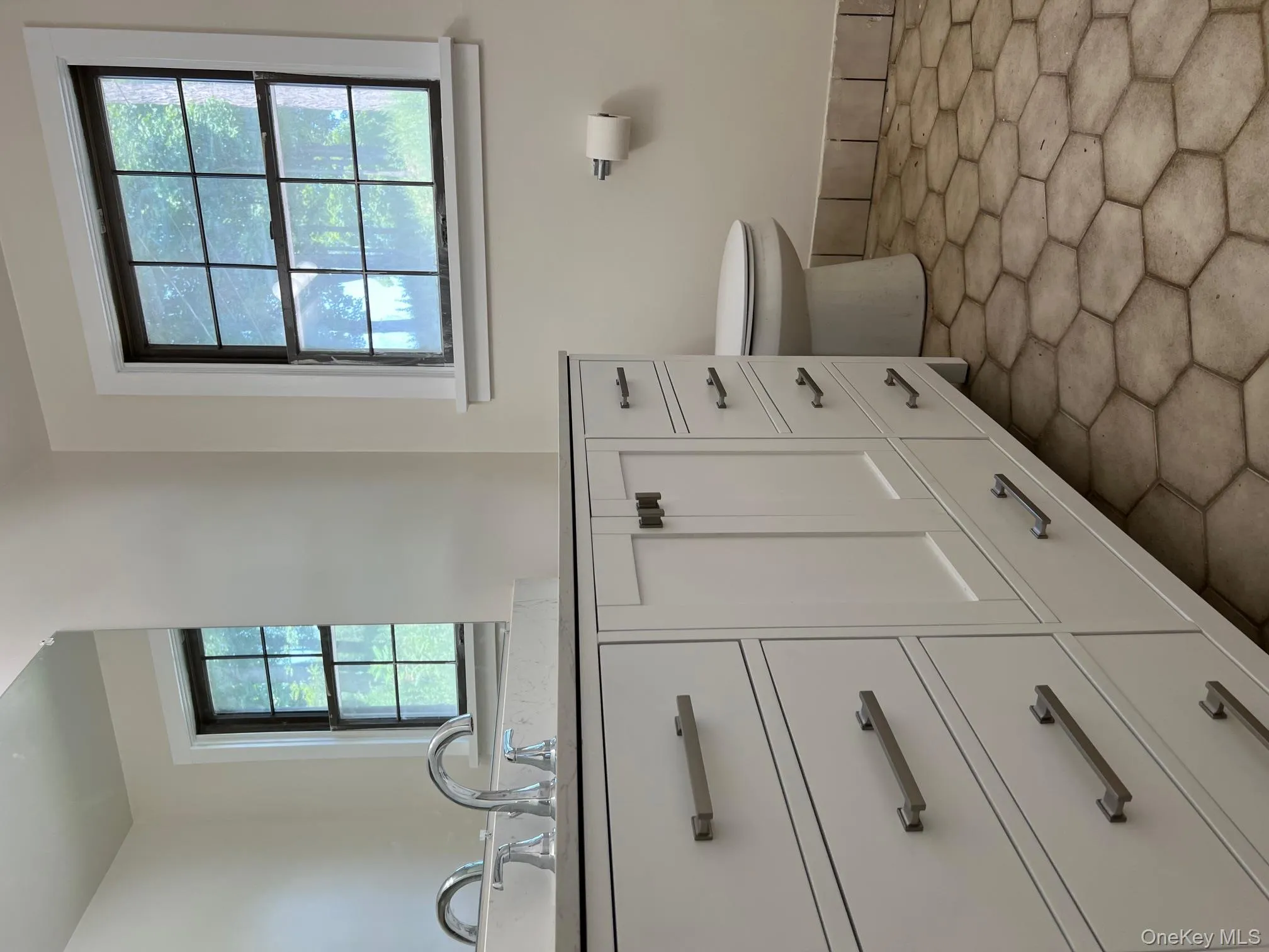 Bathroom with toilet and vanity Bathroom with toilet and vanity