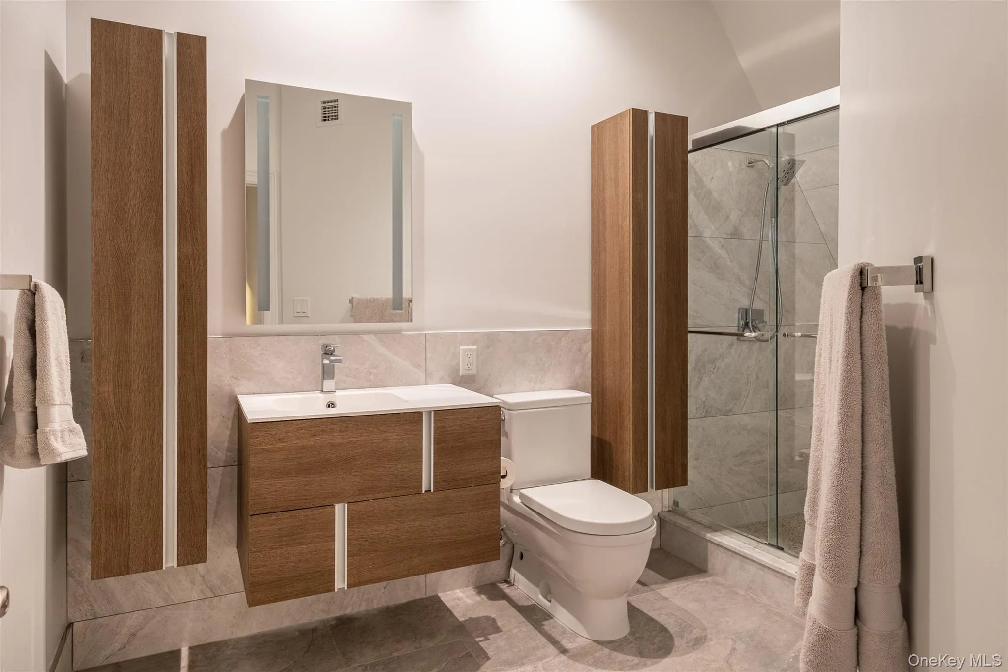 Top floor renovated full bathroom. Top floor renovated full bathroom.