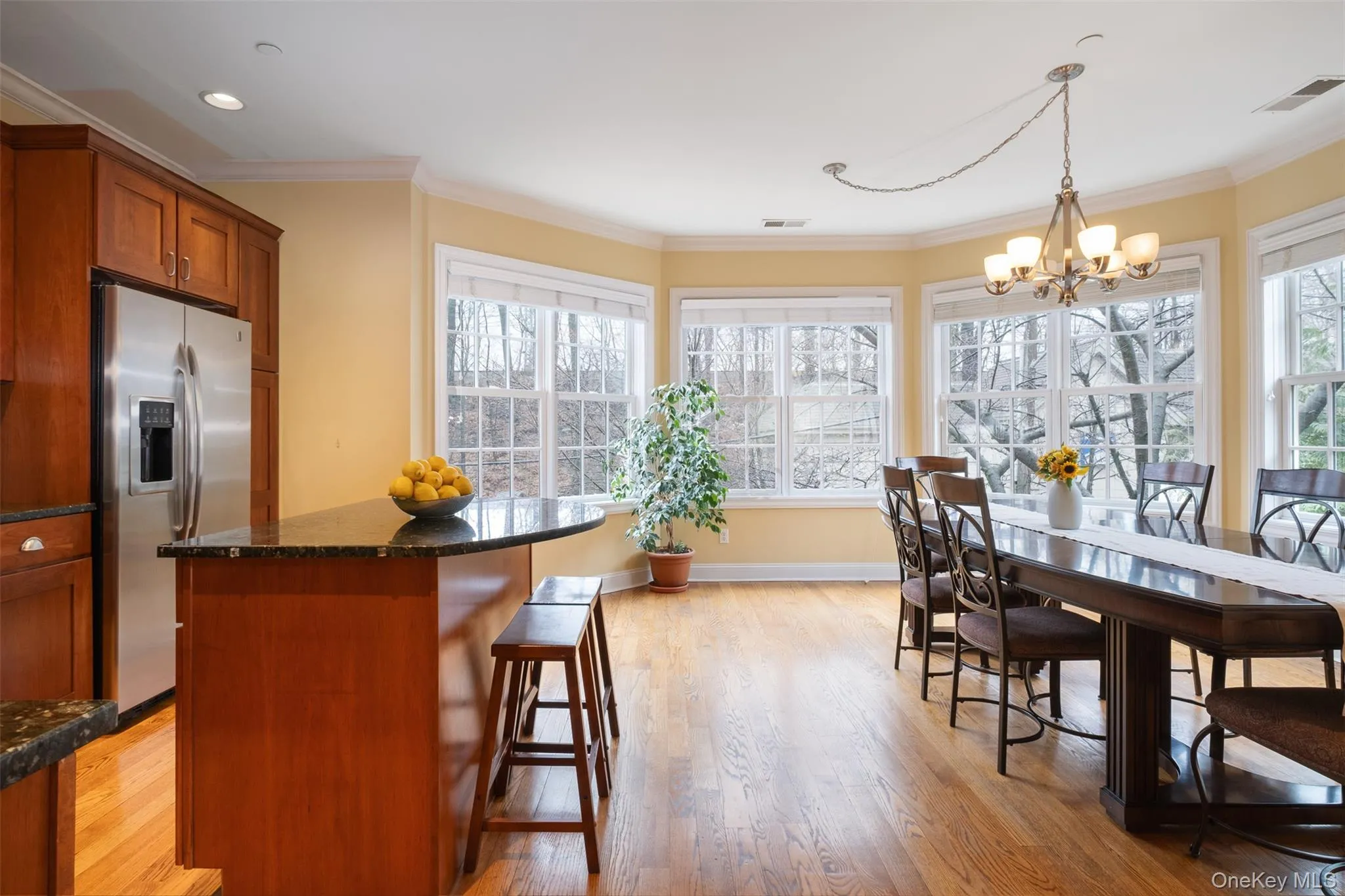 The kitchen and dining room share this space and the light from the south facing bank of windows. The kitchen and dining room share this space and the light from the south facing bank of windows.