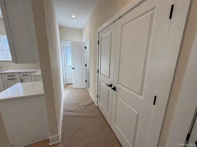 Washer/Dryer in first set of doors, Half Bath at end of hallway Washer/Dryer in first set of doors, Half Bath at end of hallway