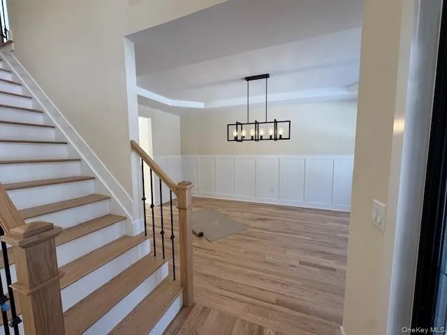 Foyer opens up to dining area with wood floors Foyer opens up to dining area with wood floors