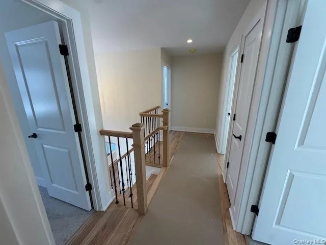Second floor hallway with access to 4 bedrooms Second floor hallway with access to 4 bedrooms