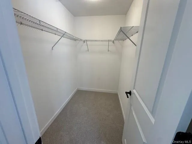 Walk in closet in primary bedroom Walk in closet in primary bedroom