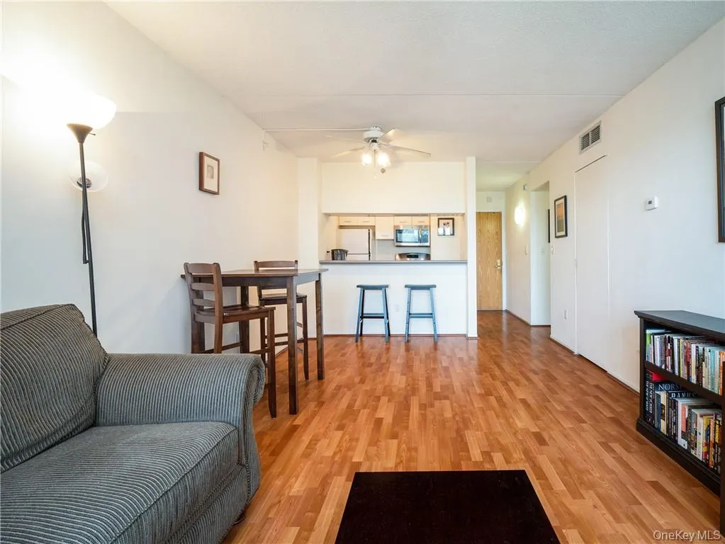 A view toward the dining area, breakfast bar and kitchen. Closet on the right. A view toward the dining area, breakfast bar and kitchen. Closet on the right.