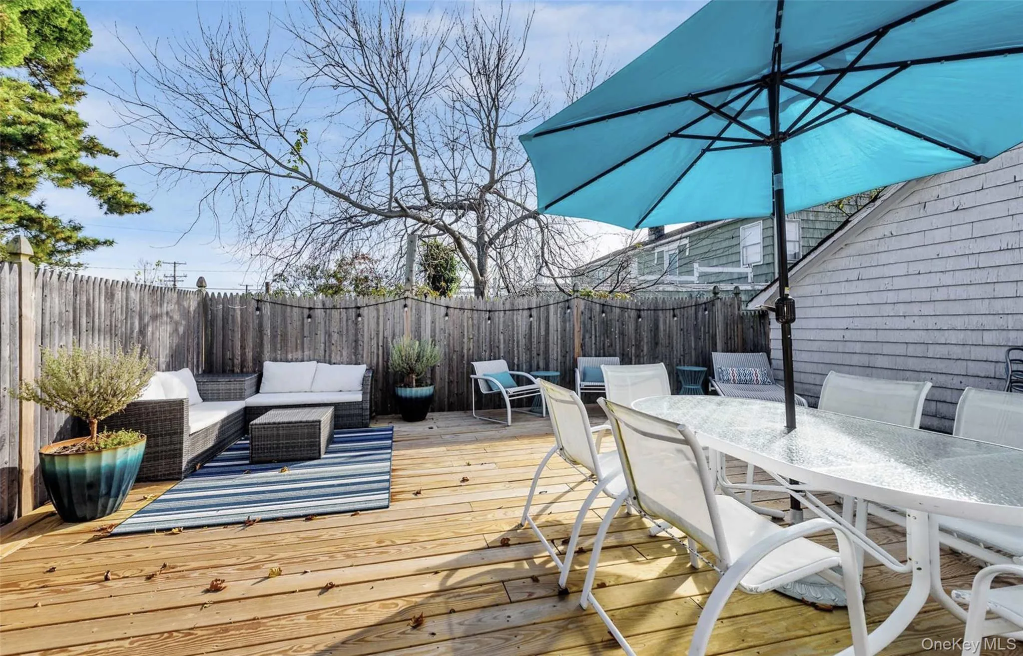 Wooden terrace with an outdoor living space Wooden terrace with an outdoor living space