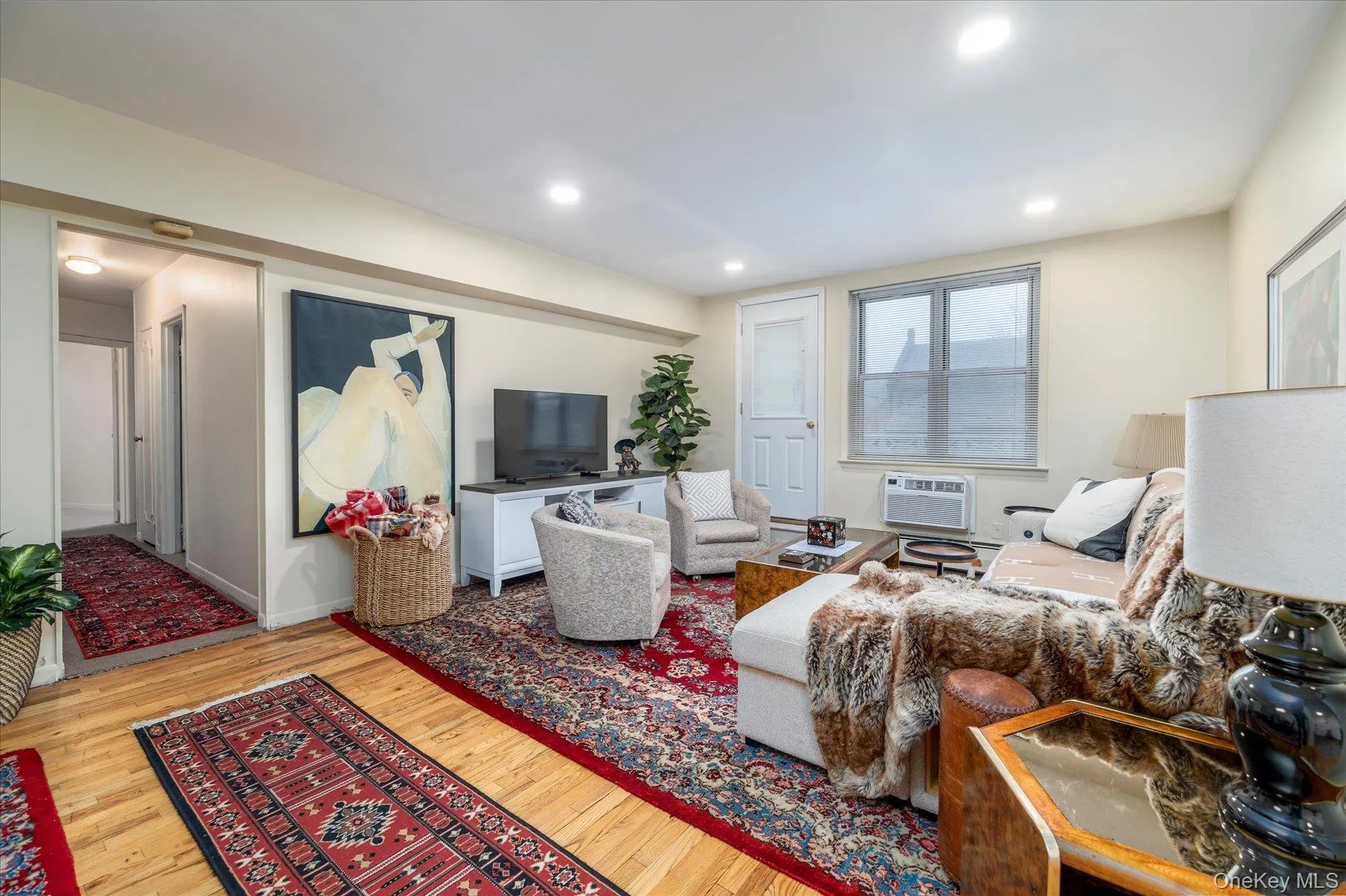 Living room with light flooring and recessed lighting Living room with light flooring and recessed lighting