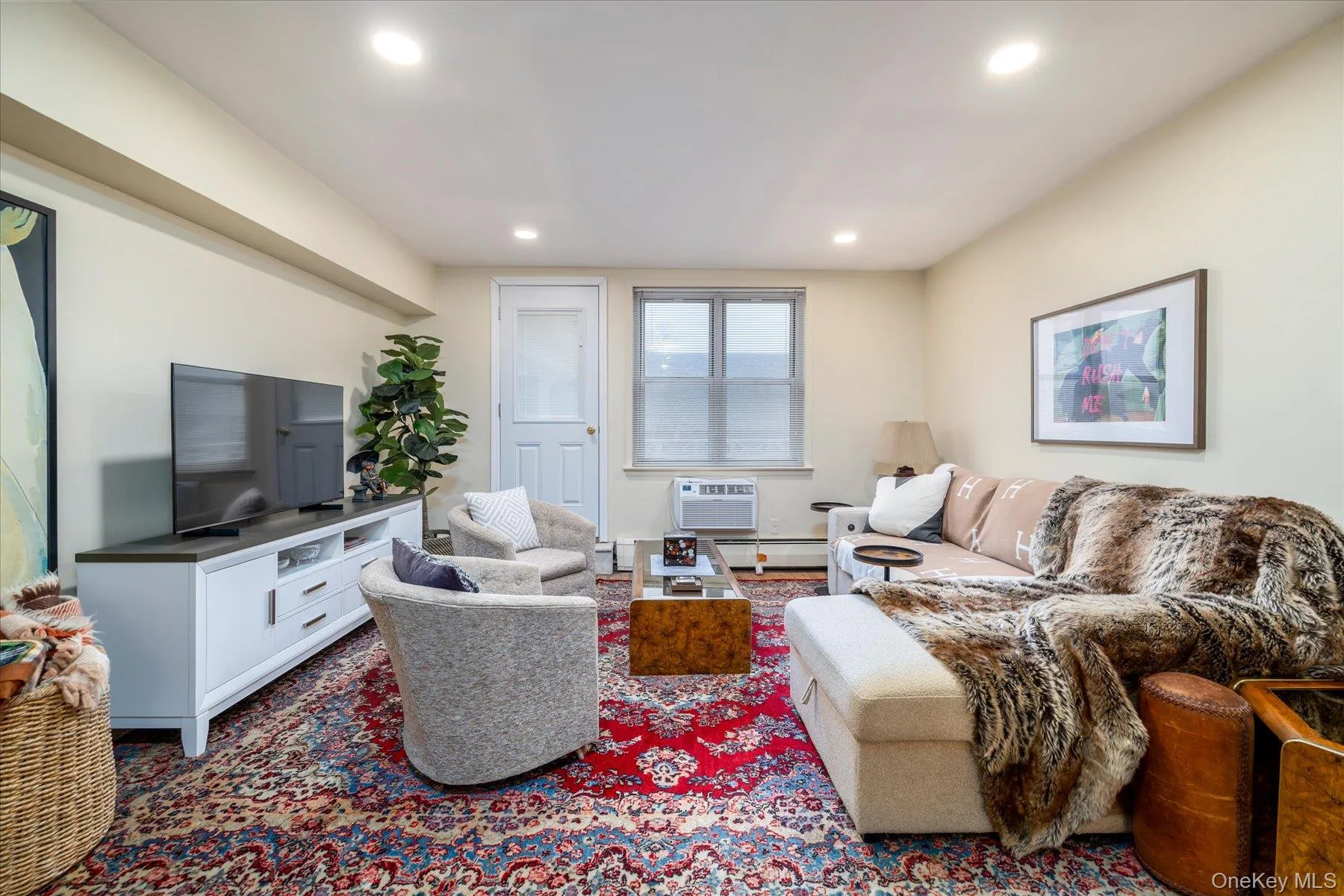 Living room with light flooring and recessed lighting Living room with light flooring and recessed lighting