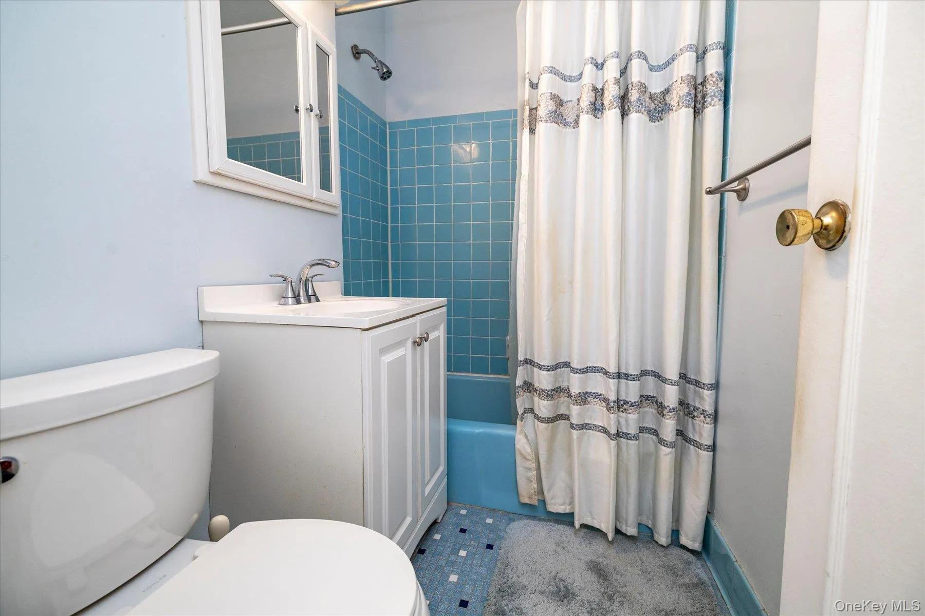 Full bath with vanity and shower / bath combo Full bath with vanity and shower / bath combo