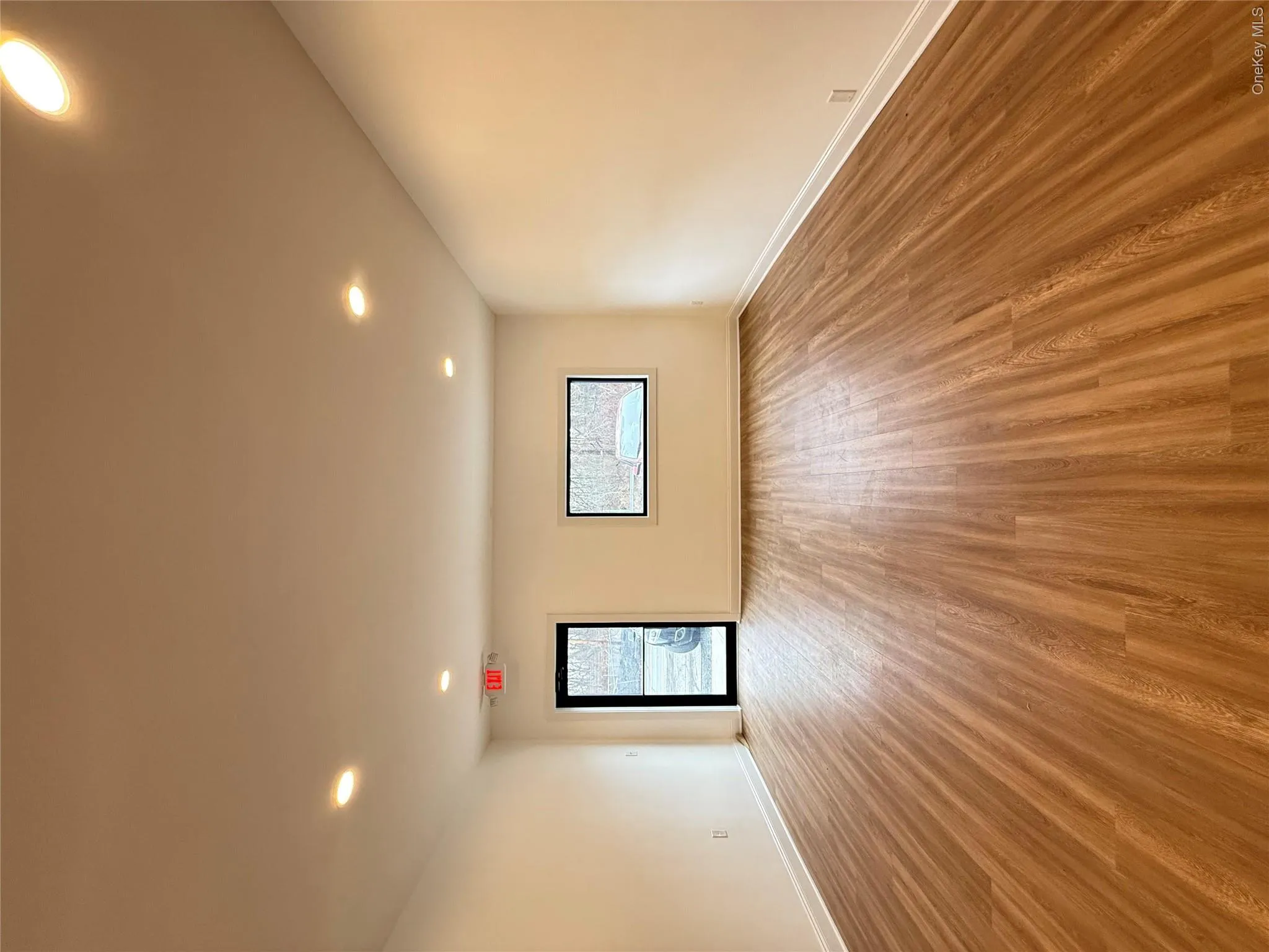 Spare room featuring light wood-style floors and recessed lighting Spare room featuring light wood-style floors and recessed lighting