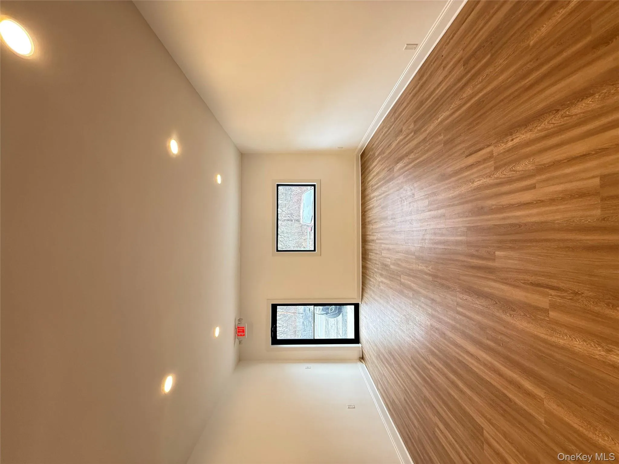 Spare room featuring light wood-style floors and recessed lighting Spare room featuring light wood-style floors and recessed lighting