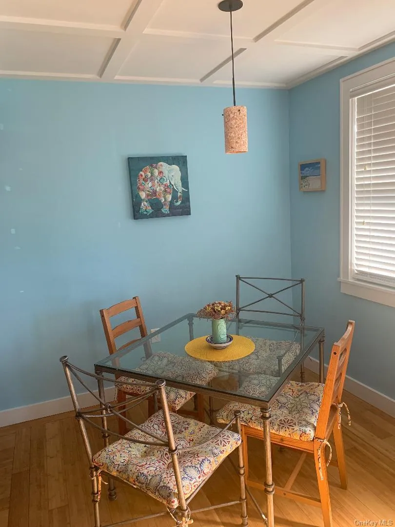 Dining space featuring wood finished floors and baseboards Dining space featuring wood finished floors and baseboards
