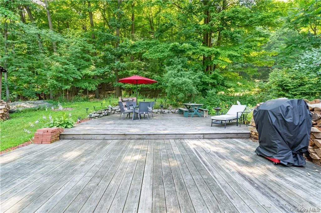 Wooden deck featuring area for grilling Wooden deck featuring area for grilling