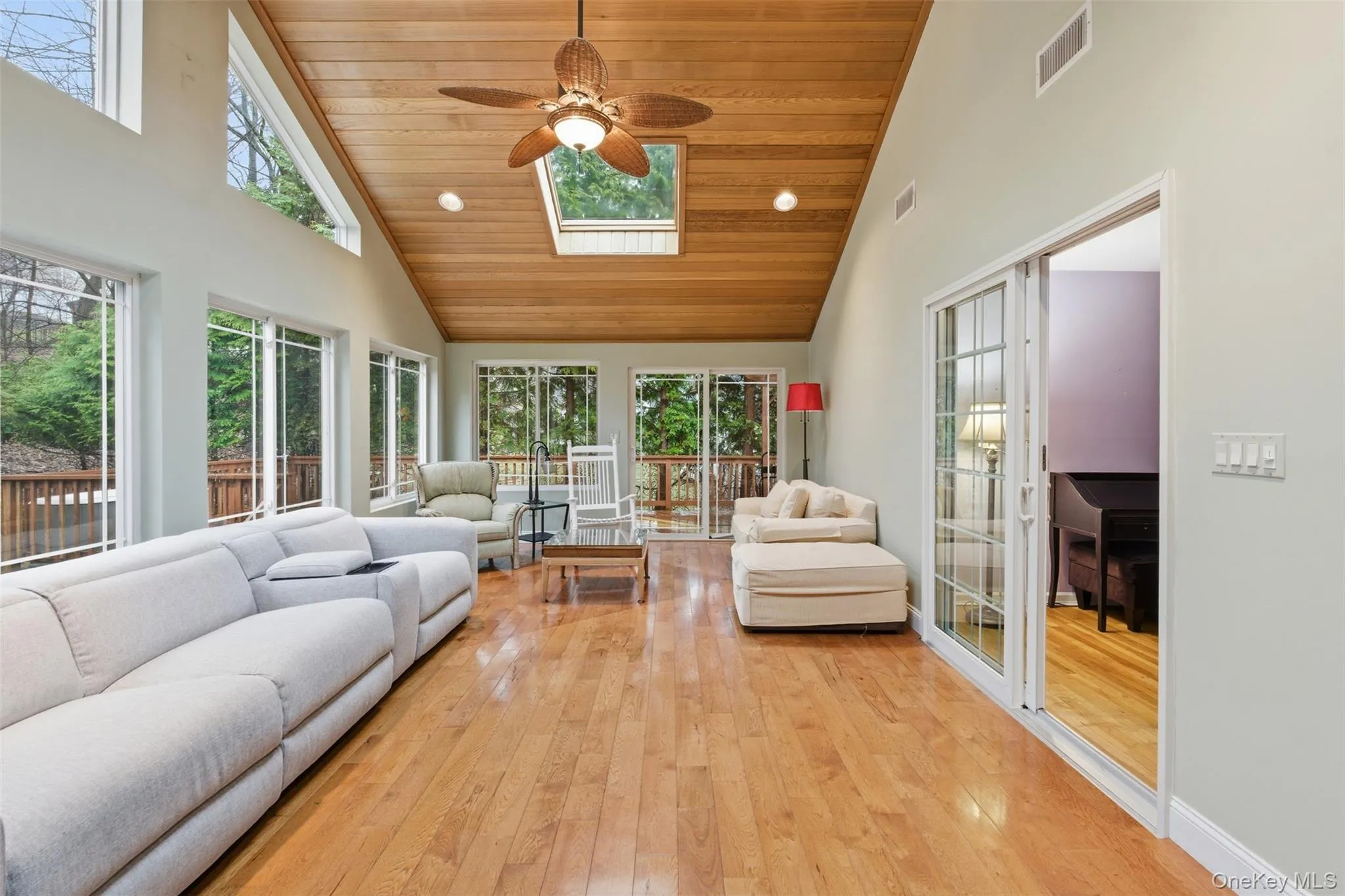 Sunroom with a skylight and lofted ceiling Sunroom with a skylight and lofted ceiling
