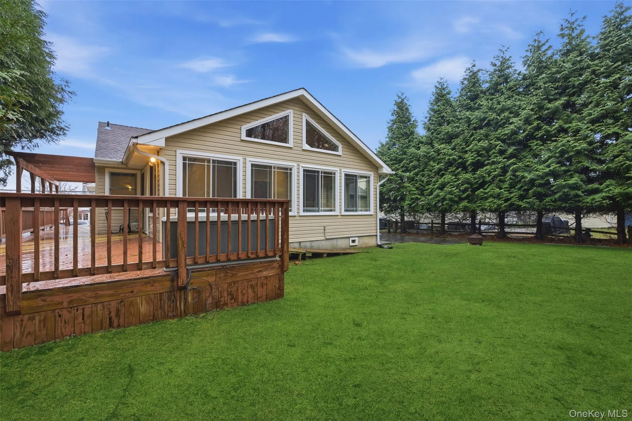 Rear view of property featuring a wooden deck Rear view of property featuring a wooden deck
