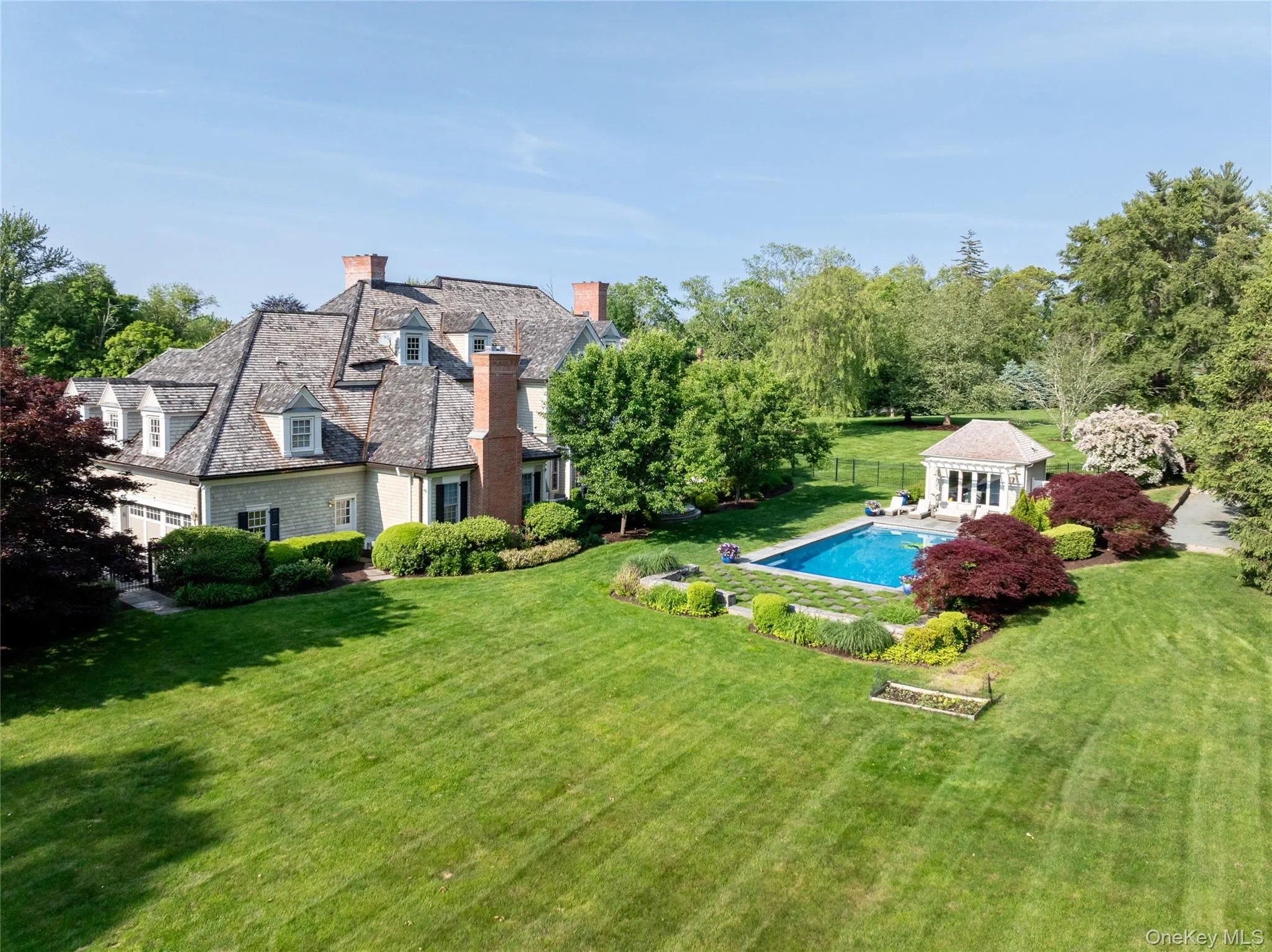View of yard featuring an outbuilding, an outdoor pool, and a storage structure View of yard featuring an outbuilding, an outdoor pool, and a storage structure