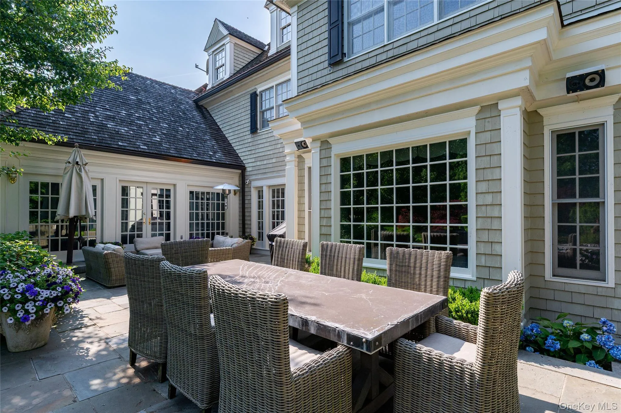 View of patio / terrace with outdoor dining area, french doors, and outdoor lounge area View of patio / terrace with outdoor dining area, french doors, and outdoor lounge area