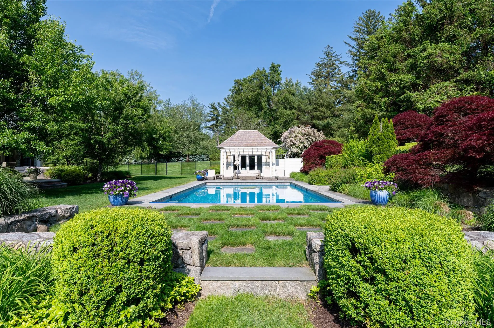 View of swimming pool with a storage structure, an outdoor structure, and a patio View of swimming pool with a storage structure, an outdoor structure, and a patio