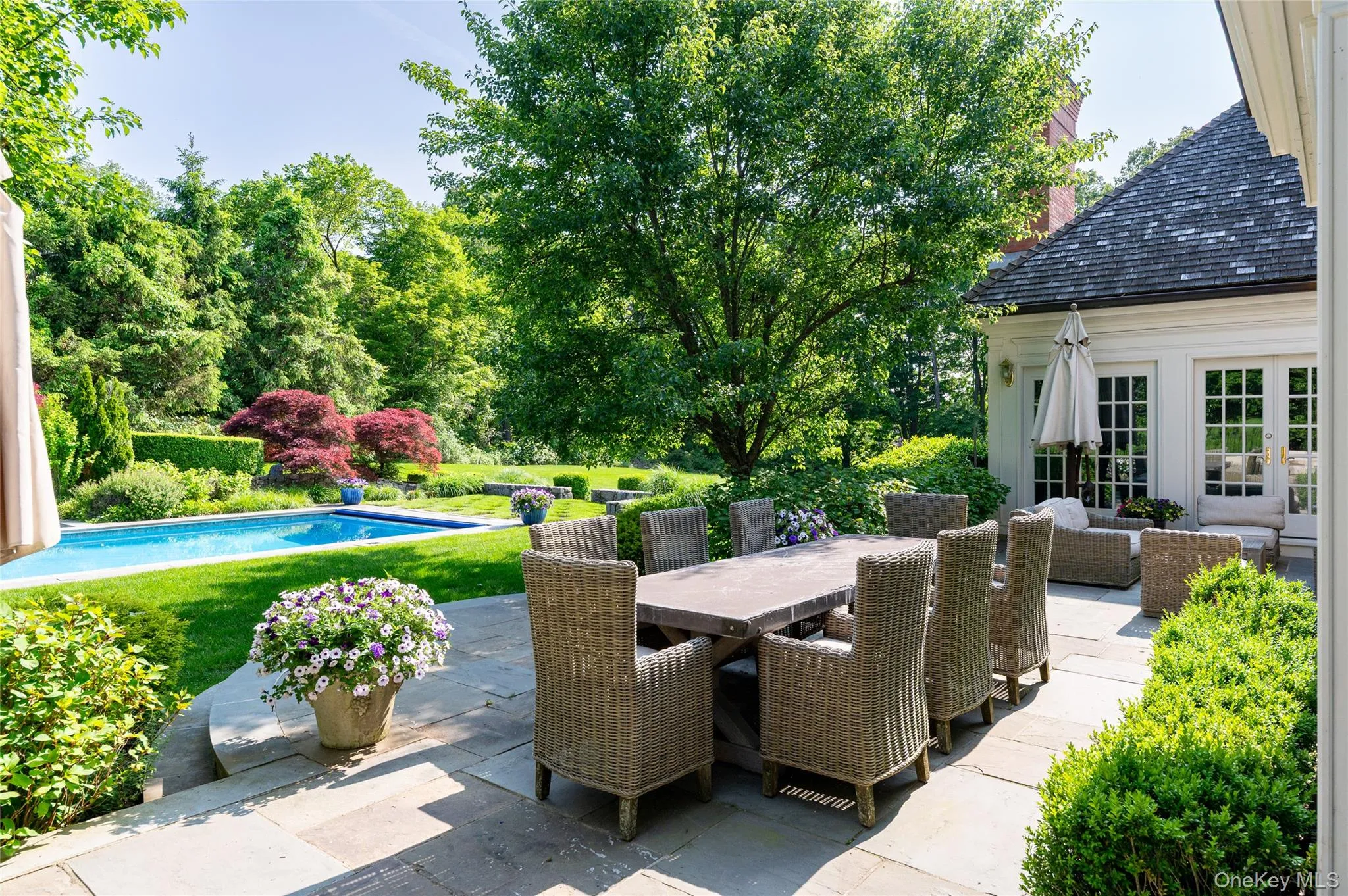 View of patio featuring an outdoor pool, outdoor dining space, french doors, and an outdoor hangout area View of patio featuring an outdoor pool, outdoor dining space, french doors, and an outdoor hangout area