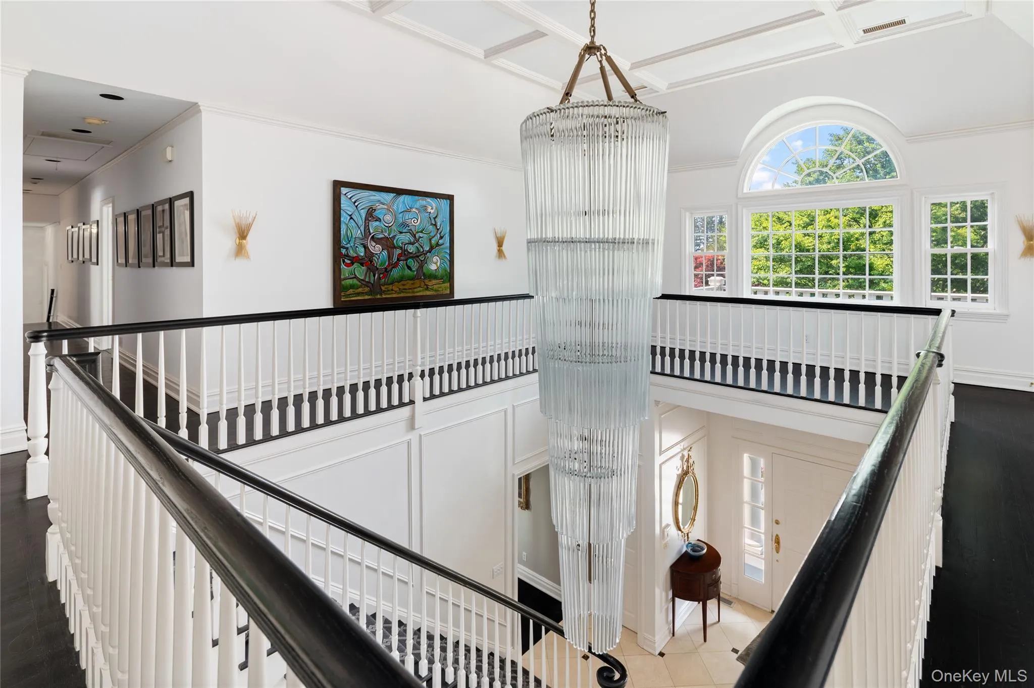 Stairs with ornamental molding and a chandelier Stairs with ornamental molding and a chandelier