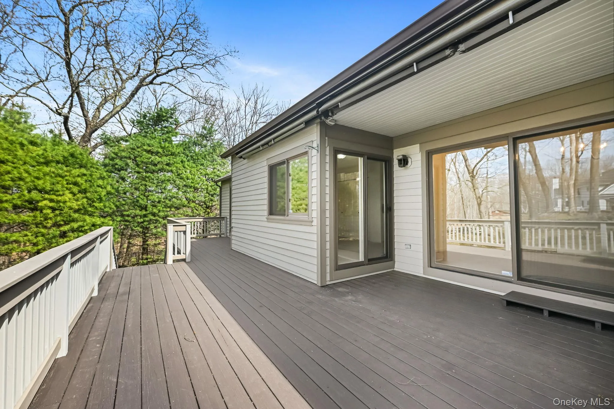 Expansive deck off of dining room, primary bedroom and 2nd bedroom. Expansive deck off of dining room, primary bedroom and 2nd bedroom.