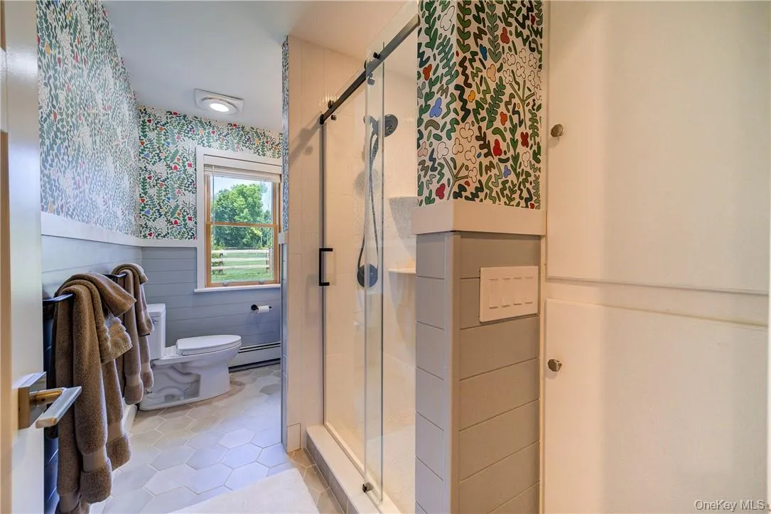 Luxury bath with fully tiled standup shower. Luxury bath with fully tiled standup shower.