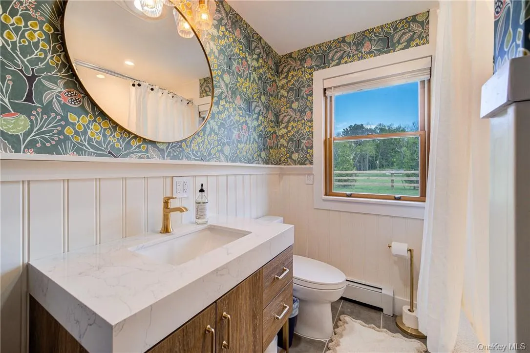 A second newly decorated bath with a tub-shower. A second newly decorated bath with a tub-shower.