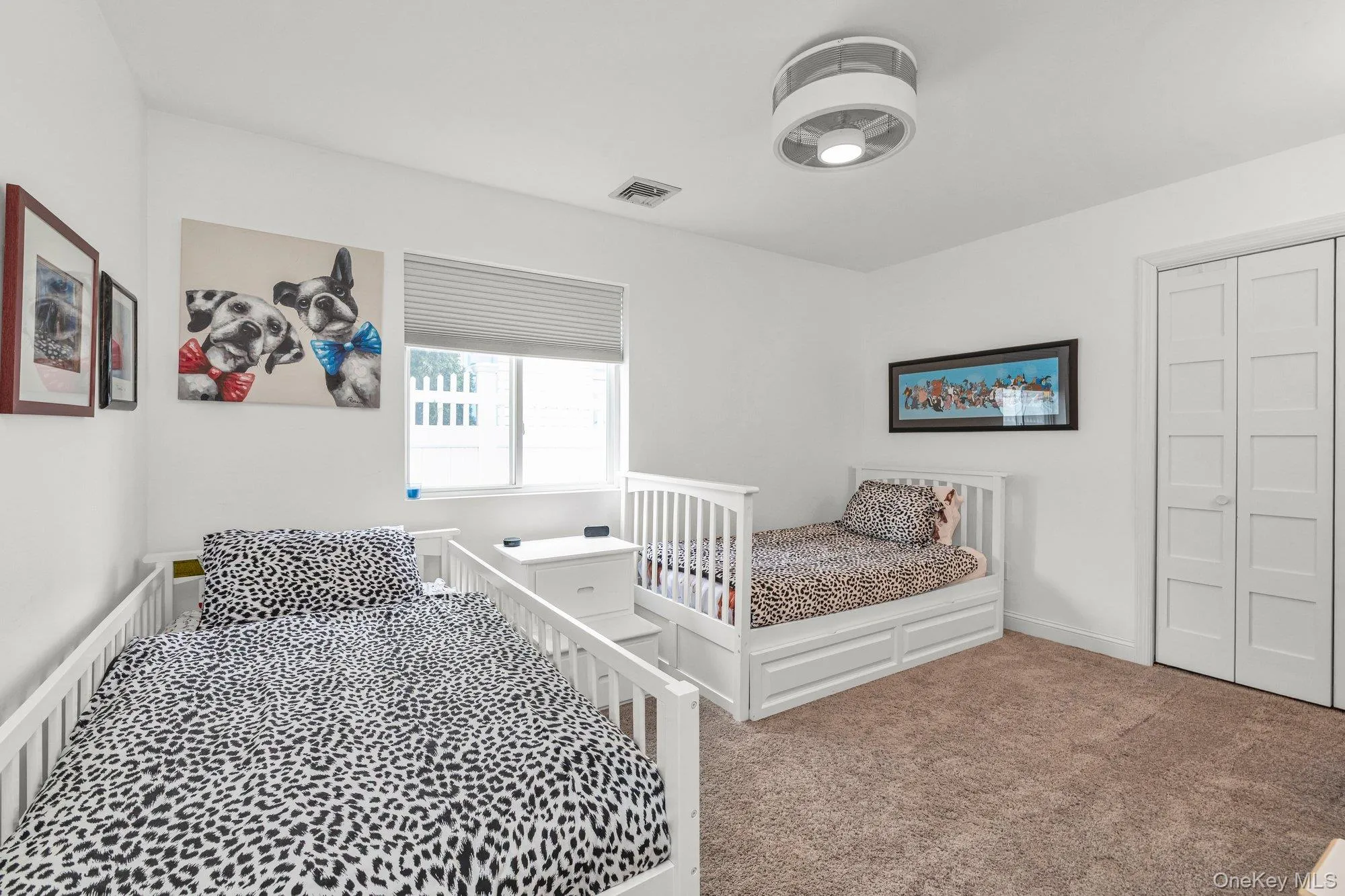 Bedroom with carpet and a closet Bedroom with carpet and a closet