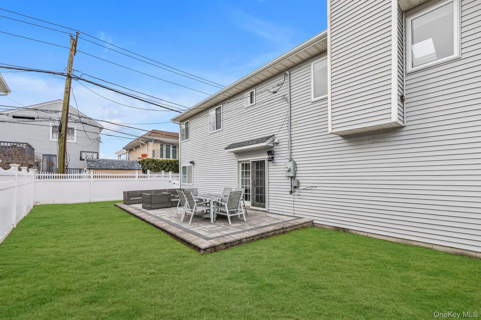Rear view of house with a fenced backyard and a deck Rear view of house with a fenced backyard and a deck