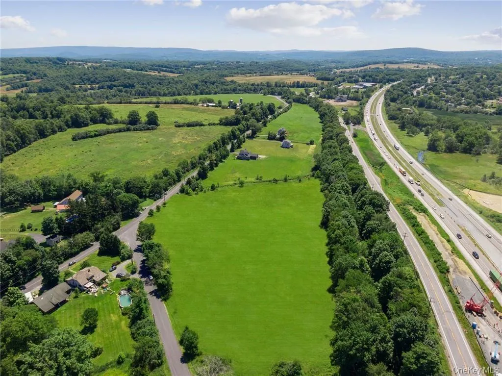 Looking east toward Woodbury Common Premium Outlets, The Castle Fun Center and Driving Range, West Point, Palisades Interstate Park and Bear Mountain, Monroe and Harriman, and I-87 (to New York Stewart International Airport, Albany, NYC). Looking east toward Woodbury Common Premium Outlets, The Castle Fun Center and Driving Range, West Point, Palisades Interstate Park and Bear Mountain, Monroe and Harriman, and I-87 (to New York Stewart International Airport, Albany, NYC).